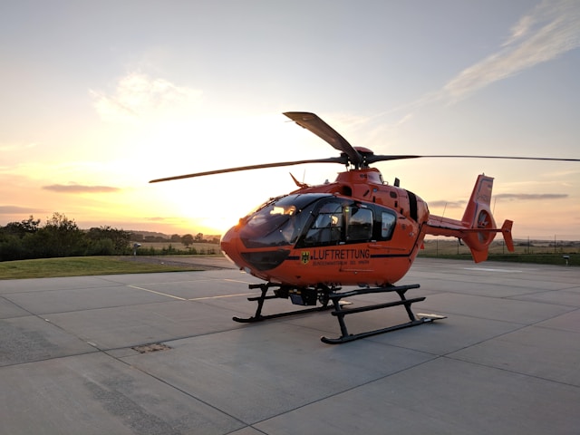 closeup-photo-of-orange-and-black-helicopter